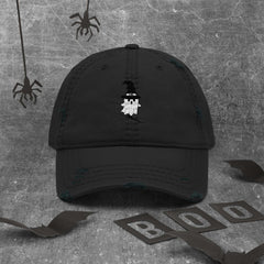 Black Northern Light Distressed Dad Hat with witch embroidery and worn brim on gray background with Halloween decorations